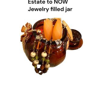 Estate to now jewelry in a Elegant Amber and Gold jar with lid mystey of fun